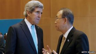 US Secretary of State John Kerry (L) listens to UN Secretary-General Ban Ki-moon prior to peace talks in Montreux