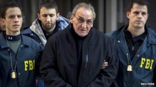 Vincent Asaro is escorted by FBI agents from their Manhattan offices in New York 23 January 2014