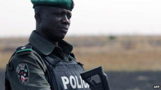 A Nigerian policeman patrols with Nigerian soldiers in the north of Borno state (file image)