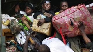 Seleka Muslim militias evacuate the Camp de Roux downtown Bangui, Central African Republic, Monday Jan. 27, 2014, to relocate and join other Selekas at the PK11 camp.