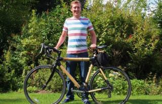 Hugh Allman with his bamboo bike