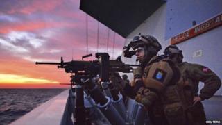 Navy officers are seen on the board the Norwegian frigate HNoMS "Helge Ingstad", in Latakia in this handout photo from January 2014 released to Reuters on January 26, 2014 by the Norwegian Armed Forces