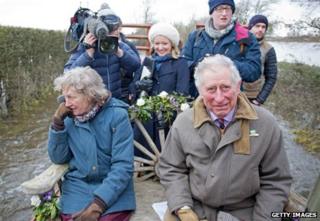 Prince Charles and his entourage on a tractor trailer in Somerset