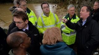 Prime Minister David Cameron with residents and emergency workers in Yalding, Kent
