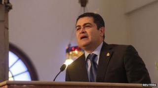 Honduran President Juan Orlando Hernandez addresses Catholics during a mass at the Basilica of Suyapa in Tegucigalpa on 3 February, 2014