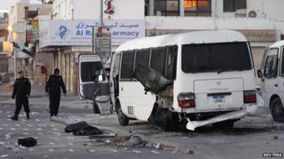A damaged Bahrain police bus