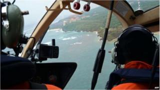 An Indonesian rescue team search for seven missing Japanese tourists