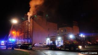 Smoke coming from top floor flat