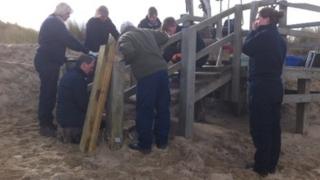 Rangers and volunteers carry out repairs