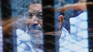 Mohammed Morsi in court. 16 Feb 2014