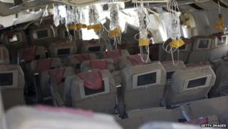 Oxygen masks hanging from ceiling of ruined Asiana plane