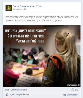 Female soldier addresses classroom