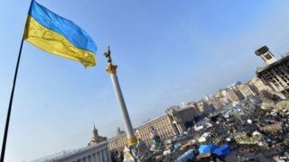 A Ukrainian flag flutters over Independence Square in Kiev