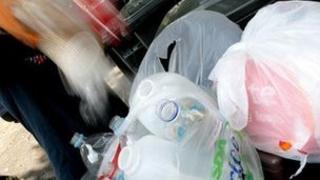 Waste being put in a bin