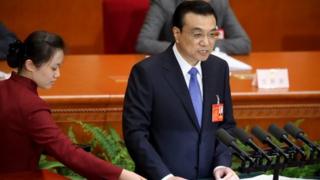 China's Premier Li Keqiang delivers the government work report during the opening ceremony of the National People's Congress (NPC) in Beijing