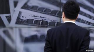 Man looking at money