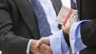 Men exchanging money