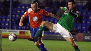 Danny Livesey of Wrexham battles with Braintree's Kenny Davis