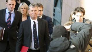 Nigel Evans, centre, is photographed walking into court