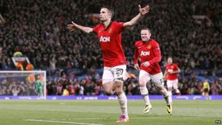 Robin van Persie celebrates after scoring a goal