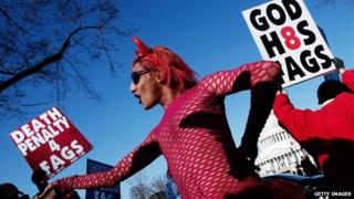 A drag performer dances in front of Westboro church members at the Supreme Court in 2013, as the court prepared to hear arguments regarding gay marriage