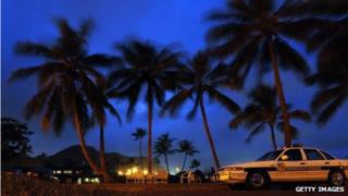 A Honolulu Police Department car sits on the street in Kailua, Hawaii, on 26 December 2008