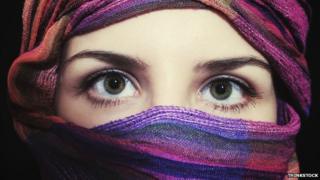 A woman wearing a headscarf