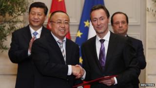 Airbus boss Fabrice Bregier, shakes hands with China's Li Hai at the Elysee Palace in Paris