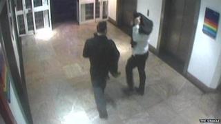 CCTV of the men smuggling the dinosaur out of The Oracle