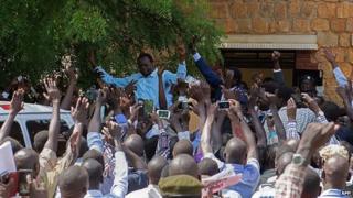 Oyai Deng Ajak (left) and Ezekiel Lol Gatkuoth leave court in Juba - 25 April 2014