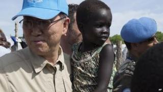 United Nation Secretary-General, Ban Ki-moon holds a child in a UN camp in Juba South Sudan, Tuesday 6 May 2014