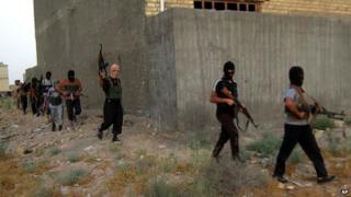 Militants on patrol in Falluja, April 2014