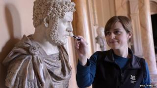 A Roman statue being cleaned