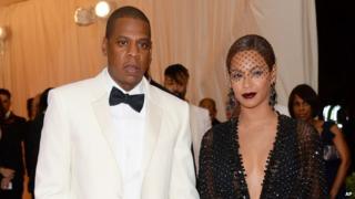 Jay Z and Beyonce walk the red carpet before a 5 May, 2014, gala at the Metropolitan Museum of Art in New York.