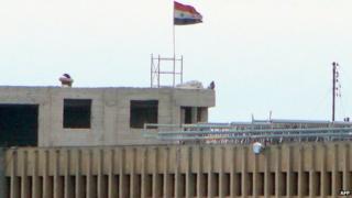 Syrian flag flies from Aleppo Central Prison (6 February 2014)
