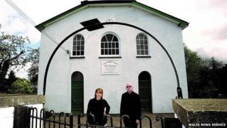 Alan Mcgee and Kat Holmes outside the former Baptist chapel in Talgarth, Powys