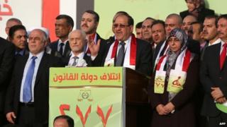 Nouri Maliki attends a State of Law election rally in Baghdad on 26 April 2014