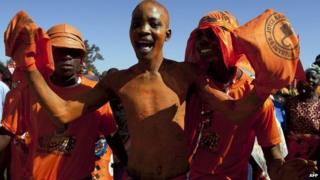 Supporters of Malawi's incumbent President Joyce Banda cheer during her final campaign rally at Songani village on the outskirts of the city of Zomba, the former capital of Malawi on 17 May 2014