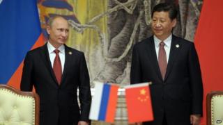 Vladimir Putin (left) and Xi Jinping