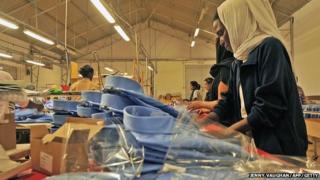 A worker packages dress shirts on the assembly floor at the Italian-owned Dolce Vita textile factory, in Eritrea.