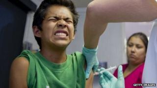 A California child receives an immunisation shot.
