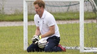 Prince Harry playing football