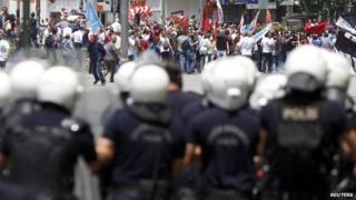 Protesters are confronted by police during a demonstration at Kizilay square in central Ankara on 16 June , 2013.