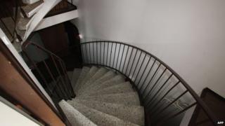 The staircase to the cellar of an apartment building, where the dead bodies of five babies were found