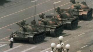 A man tries to block tanks near Tiananmen Square in Beijing. Photo: 5 June 2014