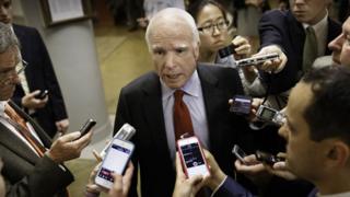 John McCain with reporters