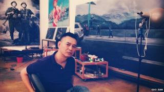 This portrait photo taken by Chinese artist Guo Jian, shows him in his studio