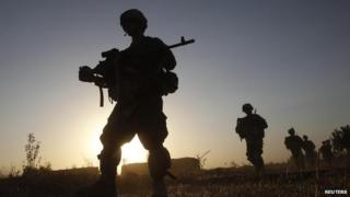 US army soldiers from Charlie company 4th platoon, 1st brigade 3-21 infantry, patrol in the village of Chariagen in the Panjwai district of Kandahar province southern Afghanistan, June 22 , 2011