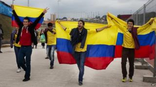 Colombian football fans chant slogans with their nation's flag outside Arena Corinthians stadium in Sao Paulo