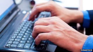 Man typing on keyboard